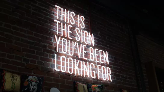 Neon Sign saying “This is the sign you've been looking for”