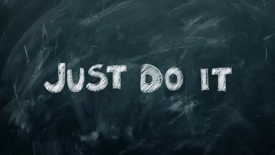 Black board with the words "Just do it" on it.