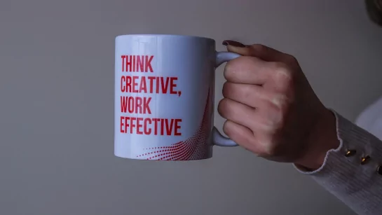Cup with text: Think Creative, Work Effective